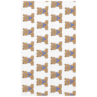 Teddy bear wearing a blue scarf tablecloth