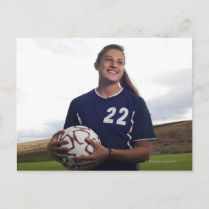 teen girl soccer player holding soccer ball postcard