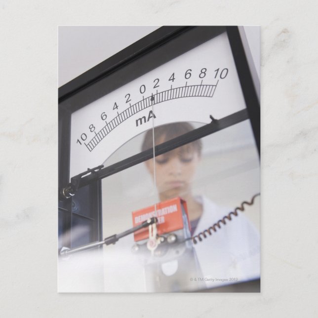 Teenage girl by science equipment postcard (Front)