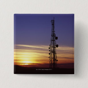 Telecommunications mast at sunset 15 cm square badge