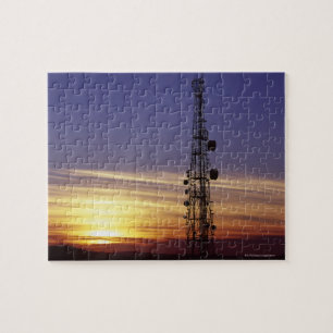 Telecommunications mast at sunset jigsaw puzzle