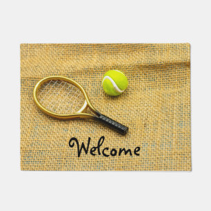 Tennis ball and racket on brown background doormat
