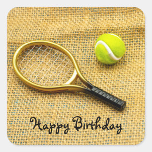 Tennis ball and racket on brown Birthday Sticker