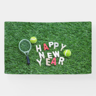 Tennis ball and racket with happy new year banner