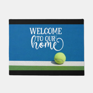 Tennis ball on the court welcome to our home doormat