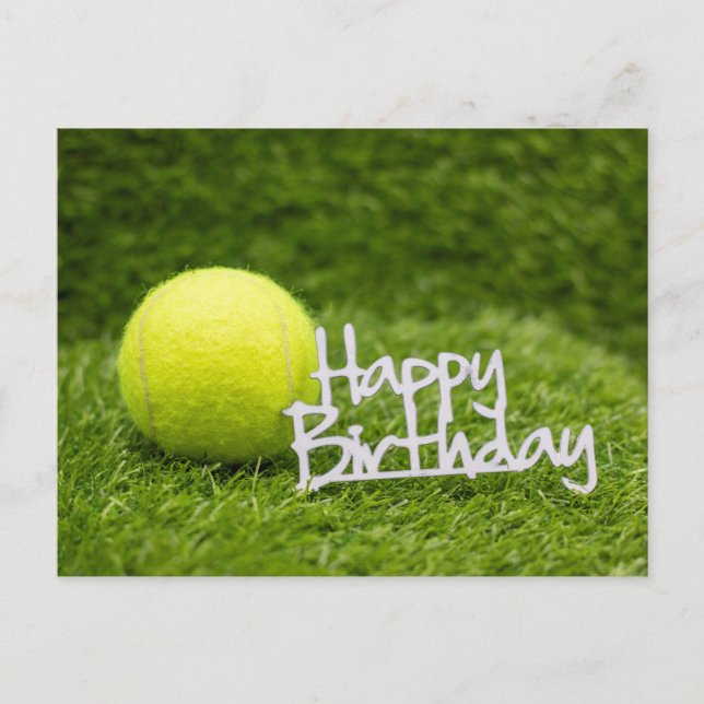 Tennis ball with happy birthday word on green post postcard (Front)