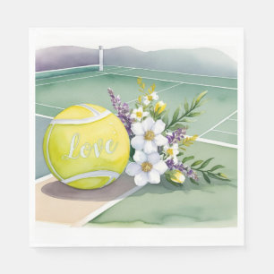 Tennis ball with red roses on the court napkin