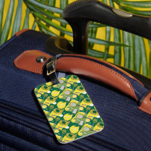 Tennis racket and ball on green grass luggage tag
