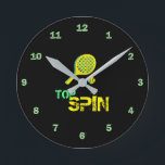 Tennis Sport Pop Art, Green & Yellow Racket & Ball Round Clock<br><div class="desc">Retro,  pop,  colourful creation of Tennis Racket silhouette,  Round Clock.
Special theme of Green & Yellow colouring,  with simple but elegant icon styled art.
Original digital art by Raphael Studio - 'Tennis'.
Retro pop & style,  unique design.</div>