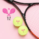 Tennis Theme Pink Girly Monogrammed Name Tennis Balls<br><div class="desc">Single tennis players and doubles teams will love this girly pink tennis themed designed. Modern logo icon style design with two rackets and a ball. Add your initials to create a customised design. Serve up style and personality with these chic, pink monogrammed tennis balls! Ideal for the fashion-forward single player...</div>