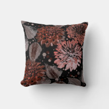 Terracotta flowers with grey leaves on a black