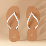 Terracotta Modern Elegant Minimal Simple Monogram Flip Flops<br><div class="desc">These trendy and stylish Terracotta Modern Elegant Minimal Simple Monogram Flip Flops offer a minimalistic design that blends seamlessly with the contemporary aesthetic. The terracotta colour palette adds an elegant touch to your footwear, while the personalised monogram brings a unique and personal aspect to your look. These flip flops make...</div>