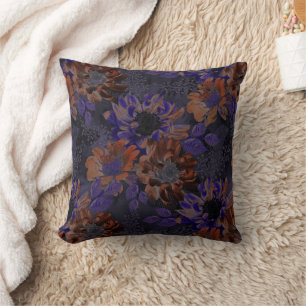 Terracotta, purple flowers on a velvety gray  cushion