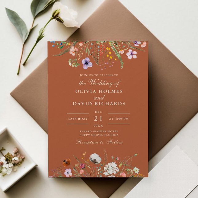 Terracotta Watercolor Wildflower Meadow Wedding Invitation (Terracotta Wildflowers Meadow Wedding Invitation on wedding table with decoration and flowers.)