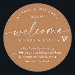 Terracotta Wedding Welcome Hotel Bag Classic Round Sticker<br><div class="desc">Terracotta Hotel Bag Stickers: Warm and contemporary, these terracotta modern handwriting stickers bring a rich, earthy elegance to your wedding welcome gifts. The 3-inch round design reads “welcome friends & family” with a sweet heart detail and personalised names and date. The terracotta background and handwritten script combine rustic warmth with...</div>