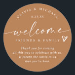 Terracotta Wedding Welcome Hotel Bag Classic Round Sticker<br><div class="desc">Terracotta Hotel Bag Stickers: Warm and contemporary, these terracotta modern handwriting stickers bring a rich, earthy elegance to your wedding welcome gifts. The 3-inch round design reads “welcome friends & family” with a sweet heart detail and personalised names and date. The terracotta background and handwritten script combine rustic warmth with...</div>