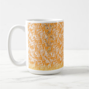 Textile pattern featuring a vibrant orange and gol coffee mug
