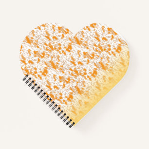 Textile pattern featuring a vibrant orange and gol notebook