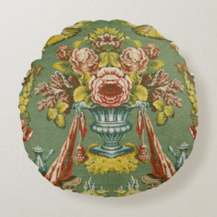 Textile with a repeating floral motif round cushion