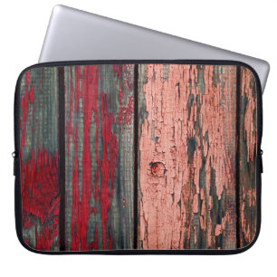 Texture of old wooden fence painted in red and ora laptop sleeve