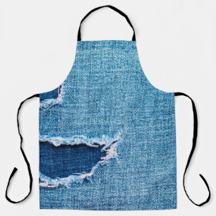 Textured denim background. Torn hole in the fabric Apron