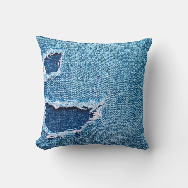 Textured denim background. Torn hole in the fabric Cushion (Front)