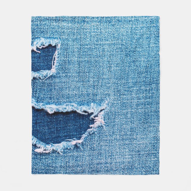 Textured denim background. Torn hole in the fabric Fleece Blanket (Front)