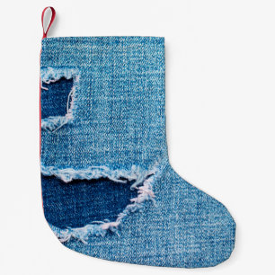 Textured denim background. Torn hole in the fabric Small Christmas Stocking