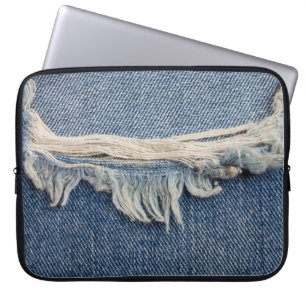 Textures ripped jeans background. laptop sleeve