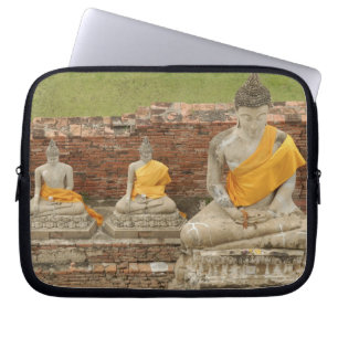 Thailand, Ayutthaya. Statues of sitting buddhas Laptop Sleeve