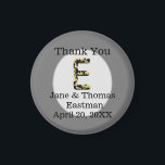 Thank You Wedding Guest Elegant E Monogram Favour Magnet<br><div class="desc">Personalise this inexpensive refrigerator magnet featuring an elegant letter E monogram. The large initial E features colours of gold and black in a vintage antique style. This letter appears within a light grey oval. The bride and groom's name and wedding date appears at the bottom of this round magnet along...</div>