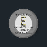 Thank You Wedding Guest Elegant E Monogram Favour Magnet<br><div class="desc">Personalise this inexpensive refrigerator magnet featuring an elegant letter E monogram. The large initial E features colours of gold and black in a vintage antique style. This letter appears within a light grey oval. The bride and groom's name and wedding date appears at the bottom of this round magnet along...</div>