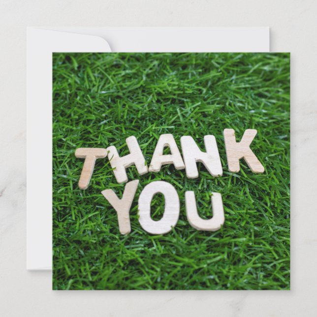 Thank you word on green grass background (Front)