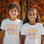 Thankful Grateful Blessed Quote Thanksgiving T-Shirt<br><div class="desc">Thankful Grateful Blessed Quote Thanksgiving. Words of gratitude in fall colours to wear at Thanksgiving or anytime with Thankful Grateful Blessed in an elegant script typography with leafy motifs.</div>