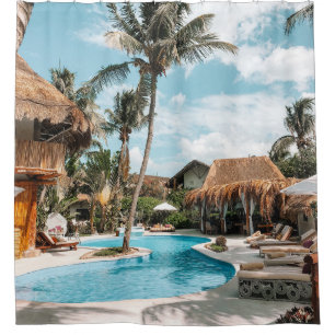 Thatch huts and houses by the pool during day shower curtain