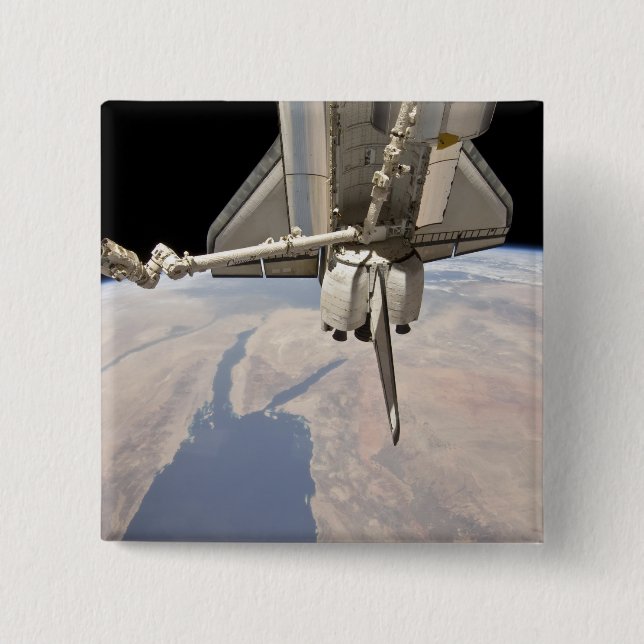 The aft section of the docked space shuttle 15 cm square badge (Front)