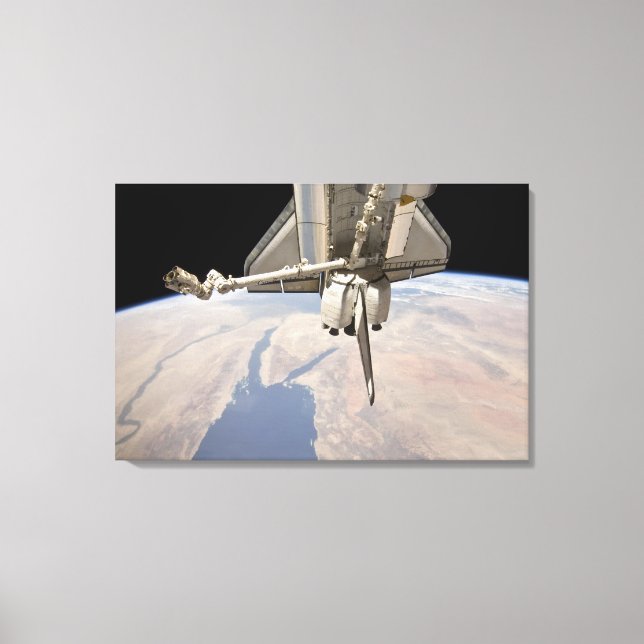 The aft section of the docked space shuttle canvas print (Front)
