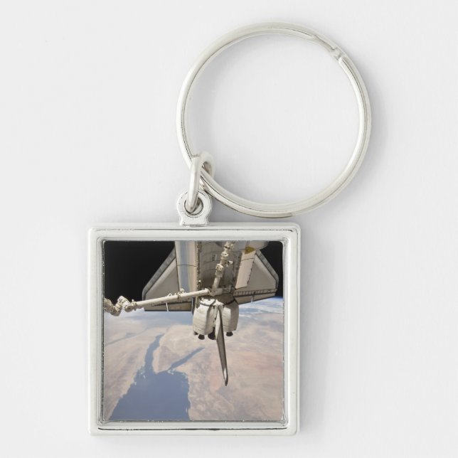 The aft section of the docked space shuttle key ring (Front)