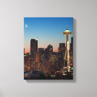 The American flag flies between the rising moon