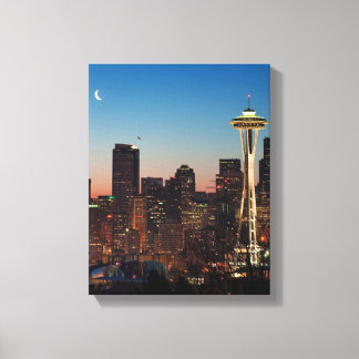 The American flag flies between the rising moon Canvas Print