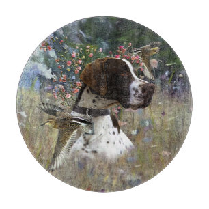 The beautiful pointer in the field cutting board