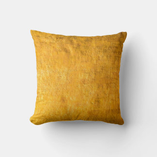 The brass concrete surface glows from the walls of cushion