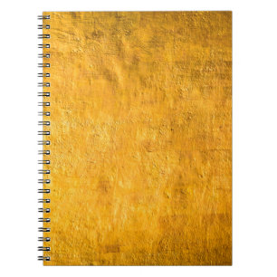 The brass concrete surface glows from the walls of notebook