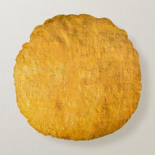 The brass concrete surface glows from the walls of round cushion
