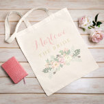 The Bride Rustic Pink Gold Floral Boho Wedding Tote Bag<br><div class="desc">Custom wedding tote bag features an elegant boho style floral design with peony flowers, botanical leaves, and rustic bird feather accents. Personalise the custom text with the name and role of the person in your bridal party. Soft colour scheme includes pretty spring shades of pink, peach, cream, green, grey, and...</div>