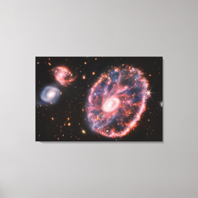 The Cartwheel Galaxy And Its Companion Galaxies. Canvas Print (Front)