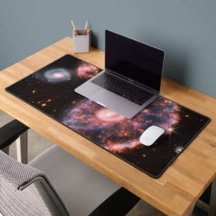 The Cartwheel Galaxy And Its Companion Galaxies. Desk Mat