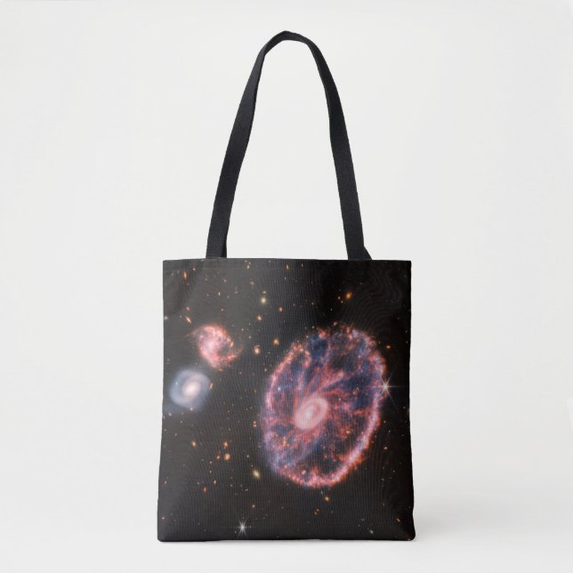 The Cartwheel Galaxy And Its Companion Galaxies. Tote Bag (Front)