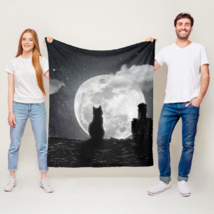 The cat dreams of the moon fleece blanket