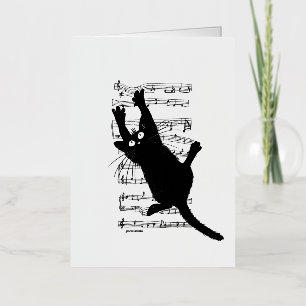 The cat hangs on musical notes